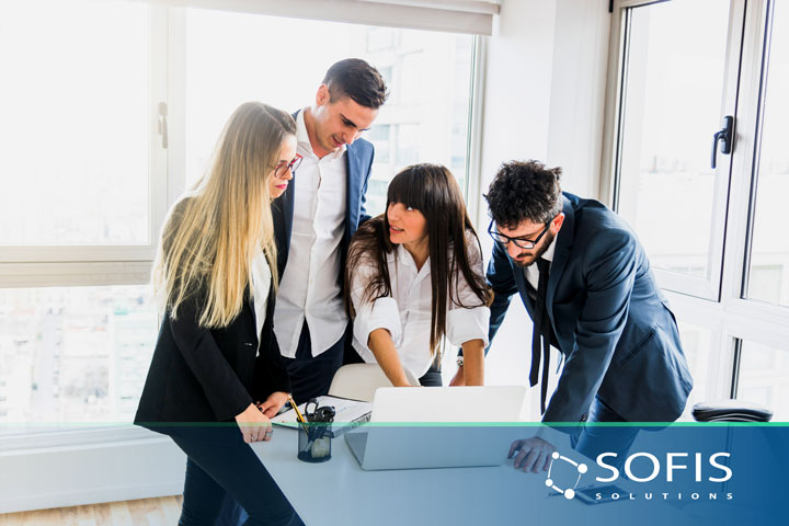 Group of people gathered in an office.